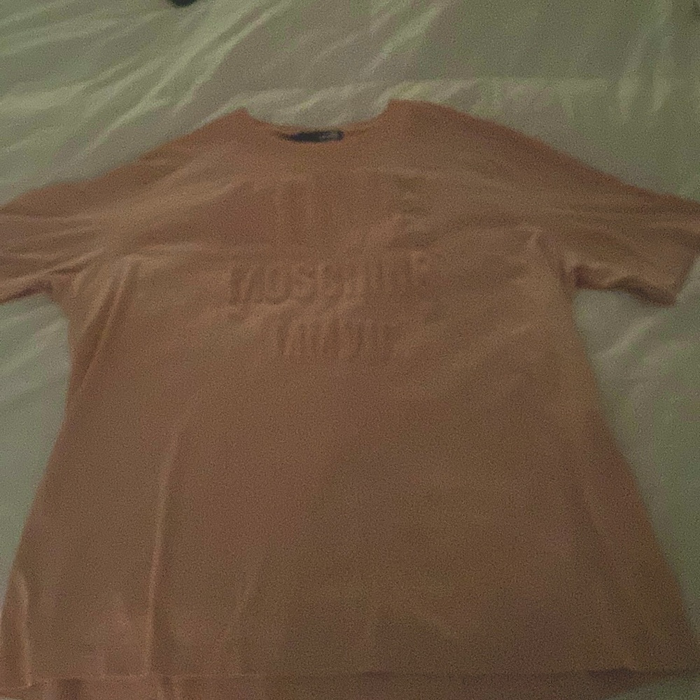 Unisex tee authentic and in new condition